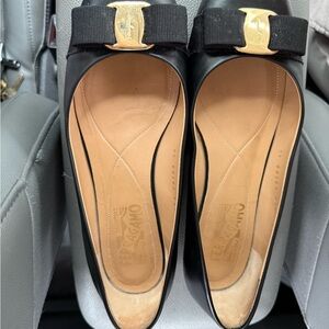 Salvatore Ferragamo Black Flats with Gold Bow Accent